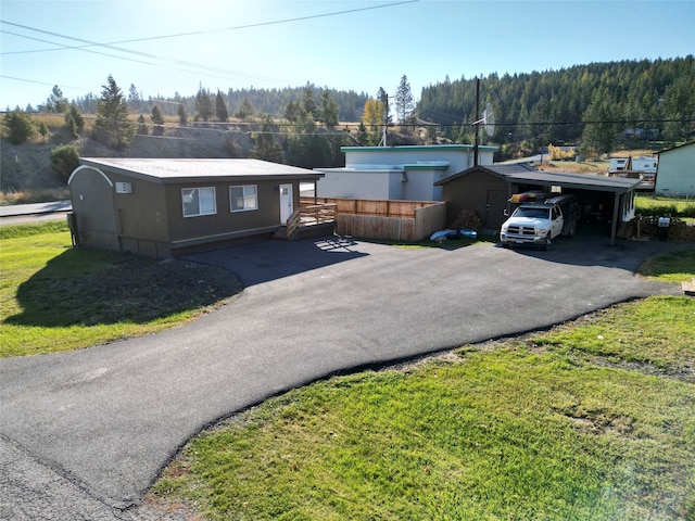 single story home featuring a front yard