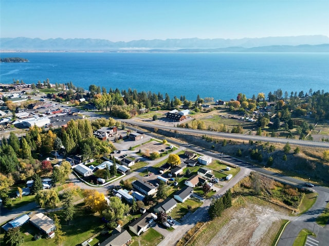 birds eye view of property featuring a water and mountain view