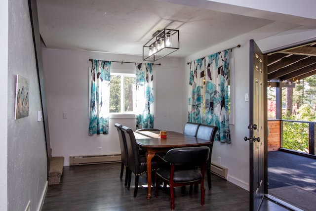 dining area featuring baseboard heating and dark hardwood / wood-style flooring