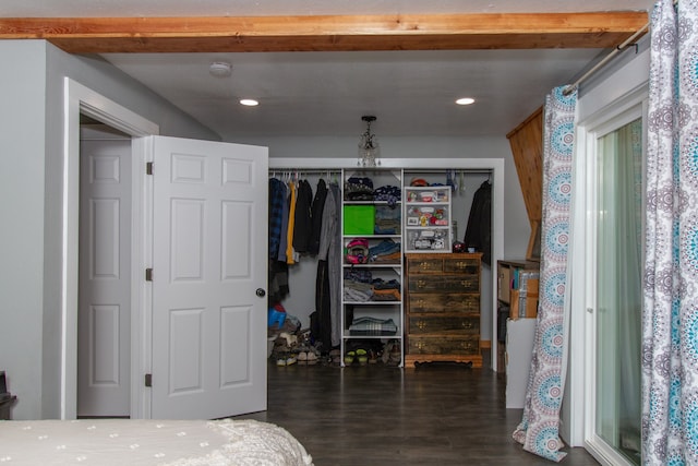 bedroom featuring a closet and dark hardwood / wood-style floors