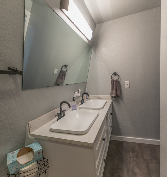 bathroom featuring vanity and hardwood / wood-style flooring