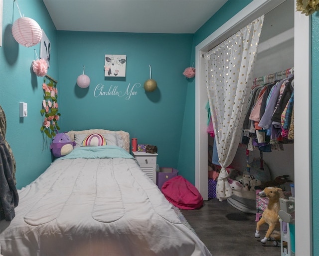 bedroom featuring a closet and hardwood / wood-style flooring