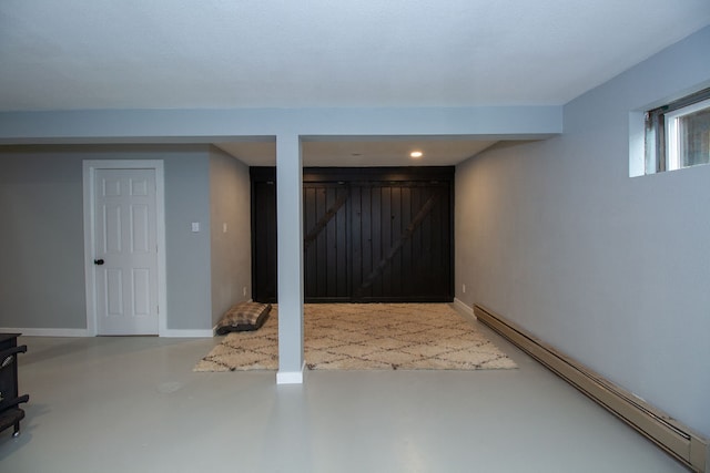 basement featuring a baseboard radiator