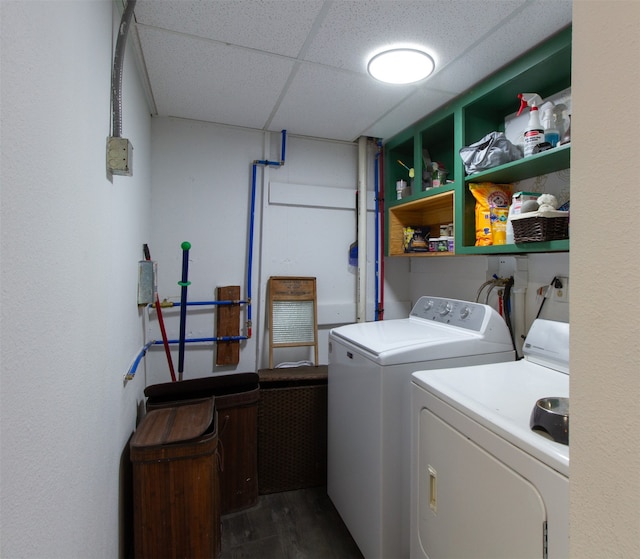 laundry area with washer and clothes dryer and dark hardwood / wood-style floors