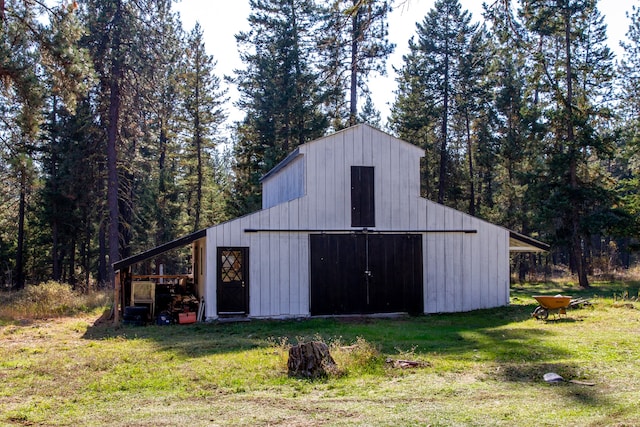 view of outdoor structure featuring a lawn