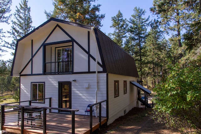 rear view of property with a deck