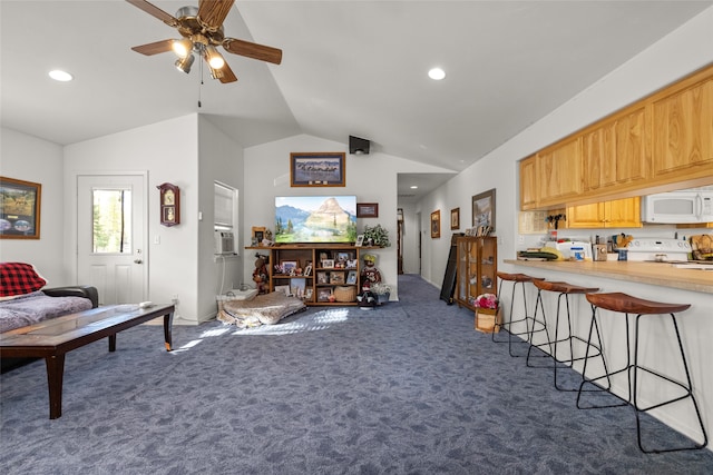 living room featuring ceiling fan, lofted ceiling, and dark colored carpet