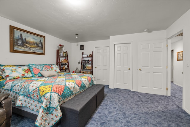 bedroom featuring dark colored carpet