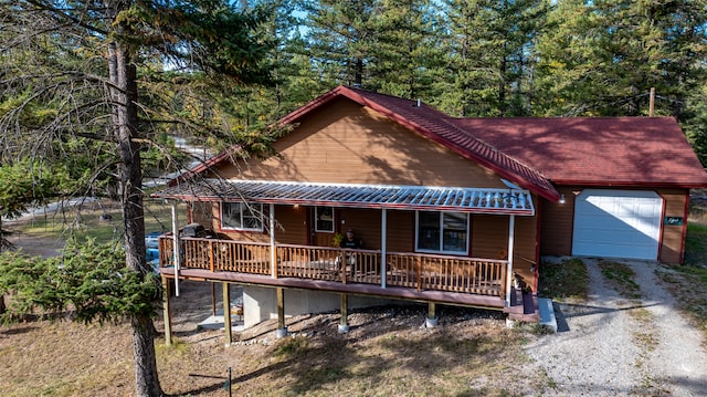 view of front of house featuring a porch and a garage