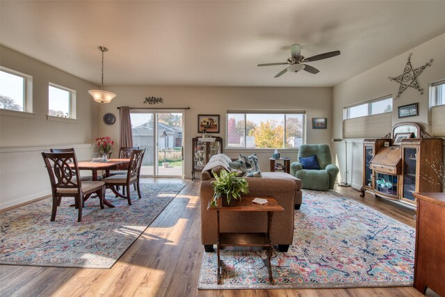 living room with ceiling fan and hardwood / wood-style flooring