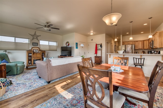 dining room featuring light wood-type flooring and ceiling fan