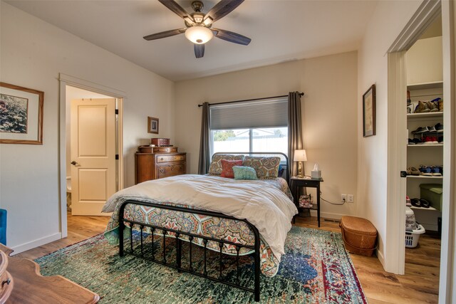 bedroom featuring hardwood / wood-style flooring and ceiling fan