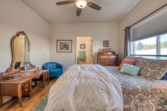 bedroom with ceiling fan and light wood-type flooring