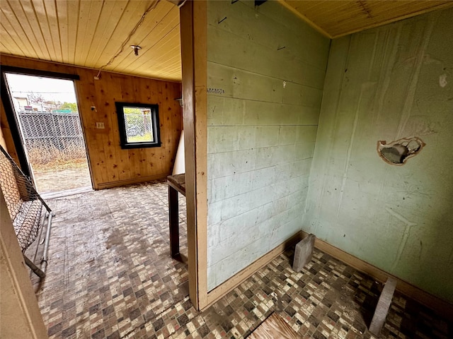 corridor with wood ceiling and wood walls