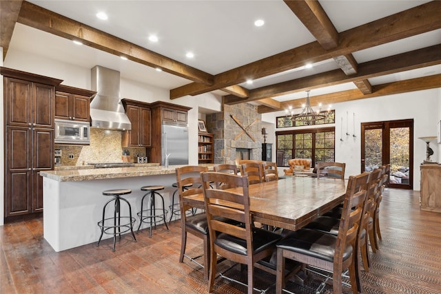 89 Slopeside Dr Unit 4, Whitefish, MT 59937 - dining space featuring dark wood-type flooring, beamed ceiling, recessed lighting, a chandelier, and coffered ceiling