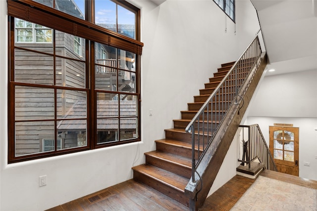 89 Slopeside Dr Unit 4, Whitefish, MT 59937 - stairs featuring a towering ceiling and wood finished floors