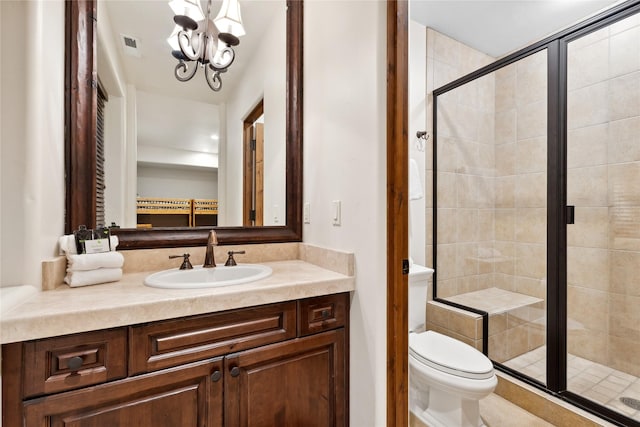 89 Slopeside Dr Unit 4, Whitefish, MT 59937 - bathroom featuring a stall shower, vanity, toilet, and a chandelier