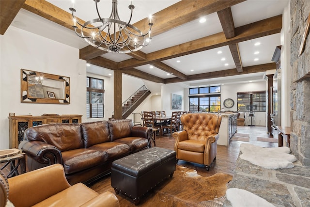 89 Slopeside Dr Unit 4, Whitefish, MT 59937 - living room with a chandelier, beamed ceiling, wood finished floors, coffered ceiling, and stairs