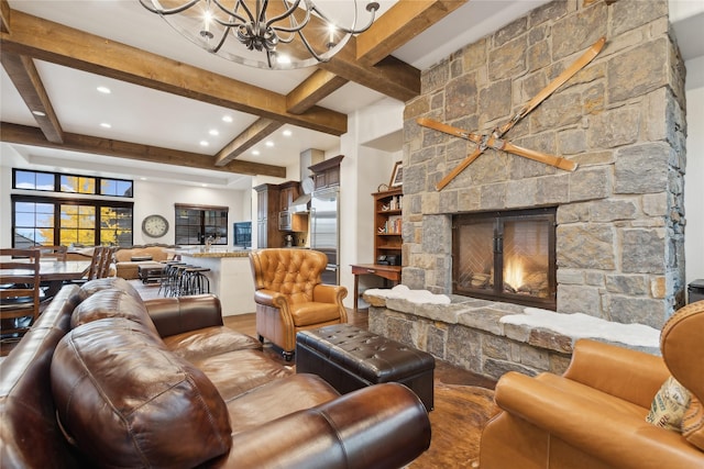 89 Slopeside Dr Unit 4, Whitefish, MT 59937 - living room featuring beamed ceiling, a chandelier, a fireplace, and recessed lighting