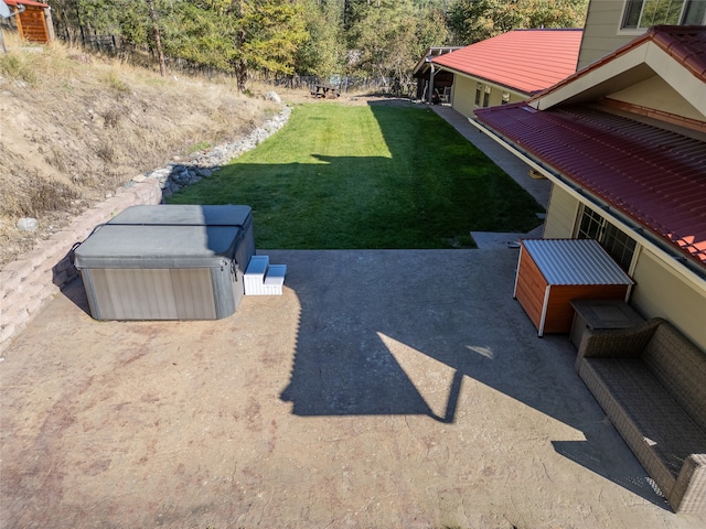 view of yard featuring a hot tub and a patio area