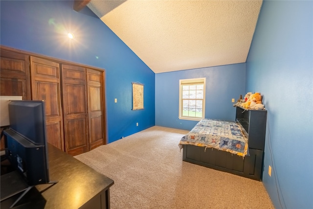 carpeted bedroom with a textured ceiling and vaulted ceiling with beams