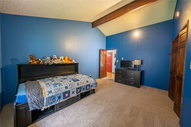 carpeted bedroom with lofted ceiling with beams and a textured ceiling