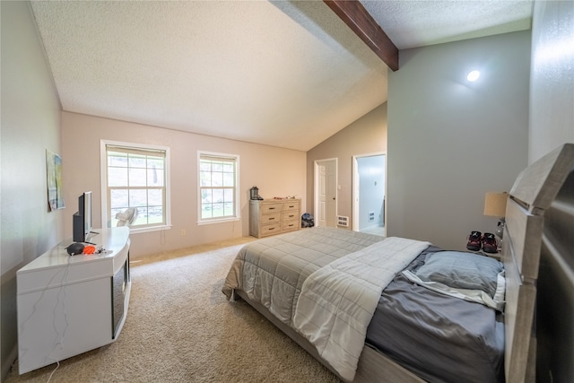 carpeted bedroom with vaulted ceiling with beams and a textured ceiling