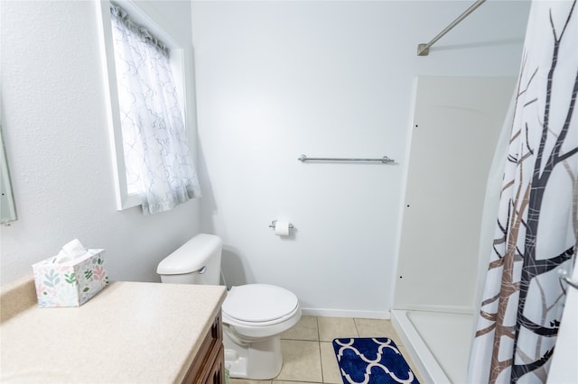 bathroom with toilet, a shower with curtain, vanity, and tile patterned floors