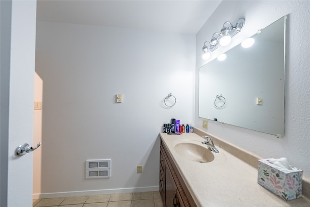 bathroom with vanity, heating unit, and tile patterned flooring