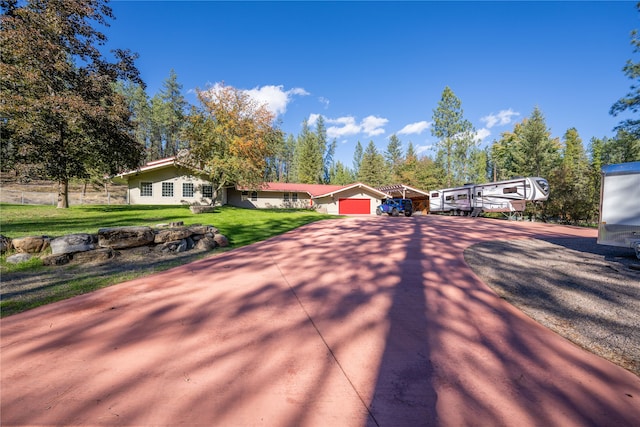 view of front of house featuring a front yard and a garage