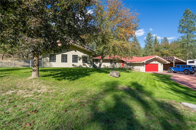 view of front of house featuring a front yard and a garage