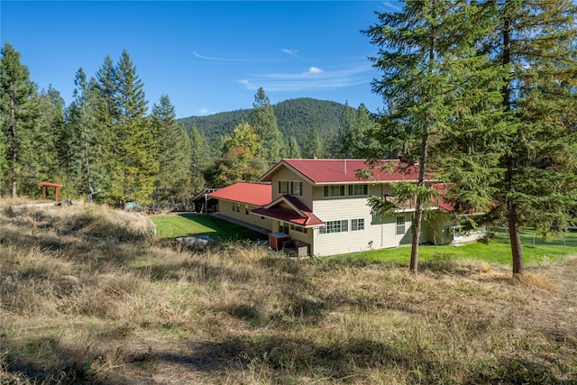 birds eye view of property featuring a mountain view