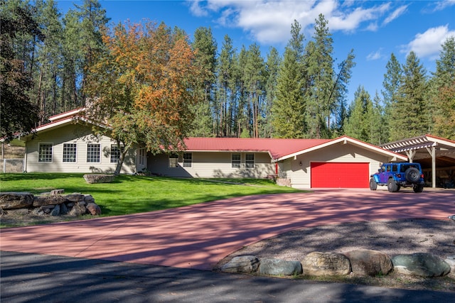 ranch-style home featuring a front yard and a garage