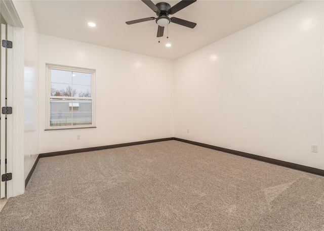 empty room with carpet floors and ceiling fan