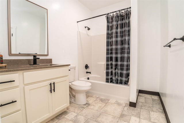 full bathroom with toilet, vanity, and shower / tub combo with curtain