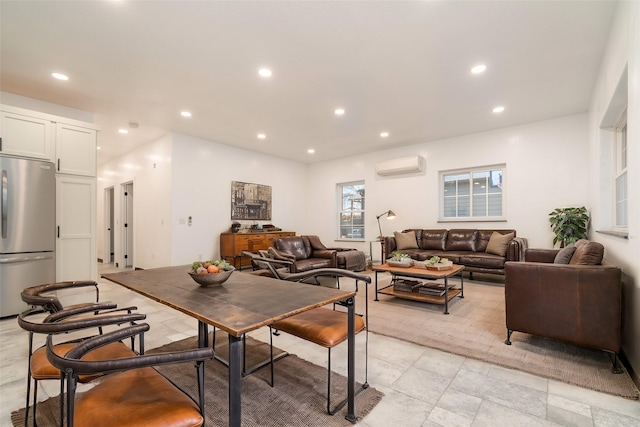 dining room featuring an AC wall unit