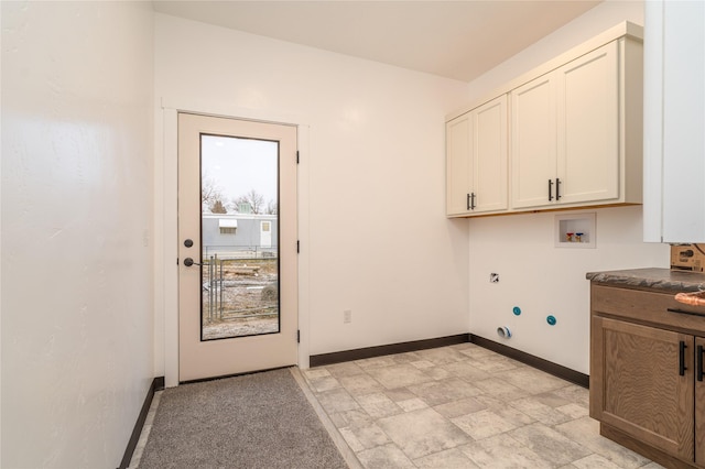 laundry room with electric dryer hookup, cabinets, and washer hookup