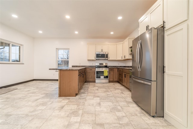 kitchen featuring kitchen peninsula and stainless steel appliances