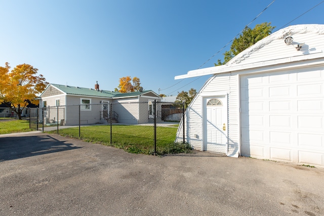 garage featuring a yard