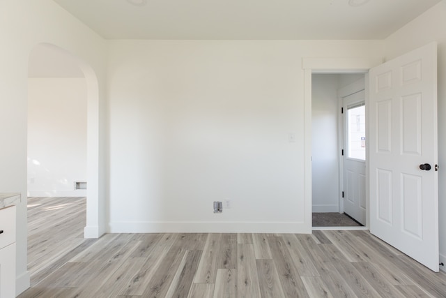 unfurnished room featuring light wood-type flooring