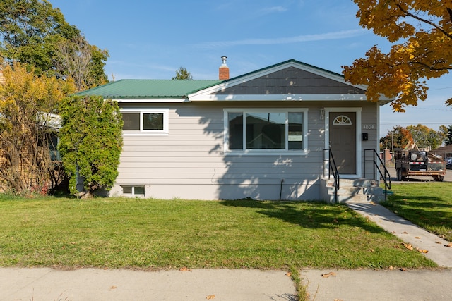 bungalow with a front yard