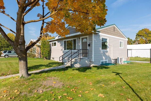 view of front of property with a front lawn