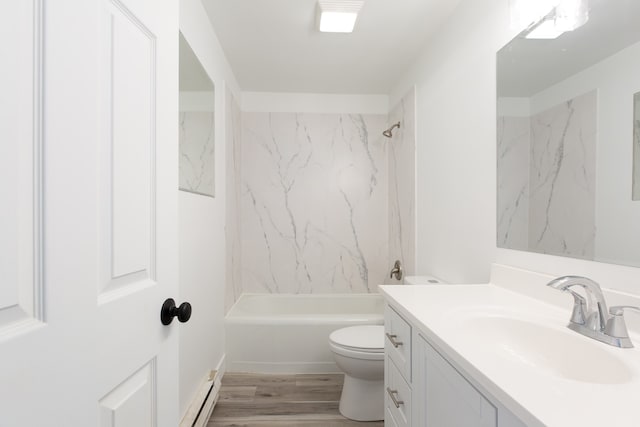 full bathroom with hardwood / wood-style floors, a baseboard heating unit, toilet, vanity, and tiled shower / bath combo