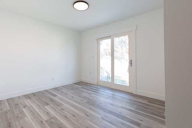 unfurnished room featuring light hardwood / wood-style flooring