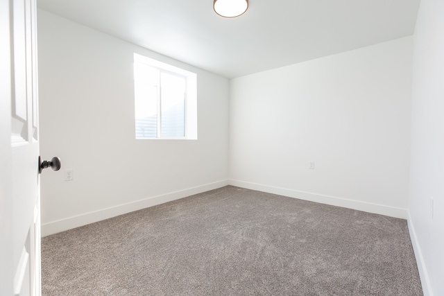 spare room featuring carpet floors