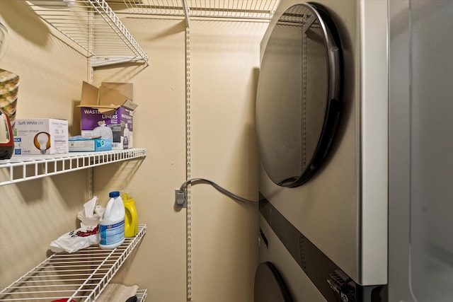 laundry area with stacked washer / dryer