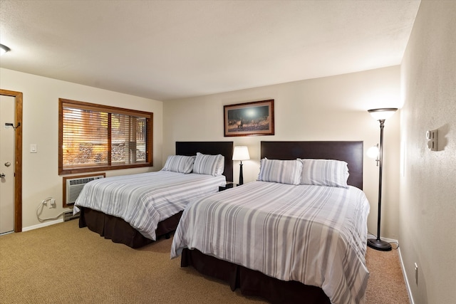 bedroom with carpet flooring and a wall unit AC