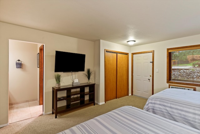 bedroom featuring light carpet