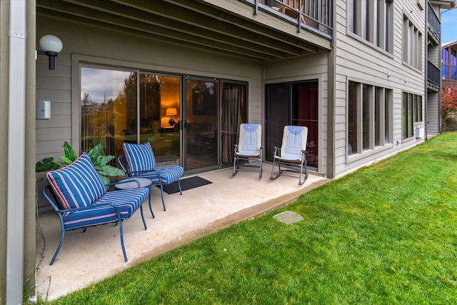 view of patio featuring a balcony