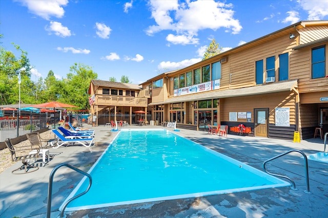 view of swimming pool featuring a patio area